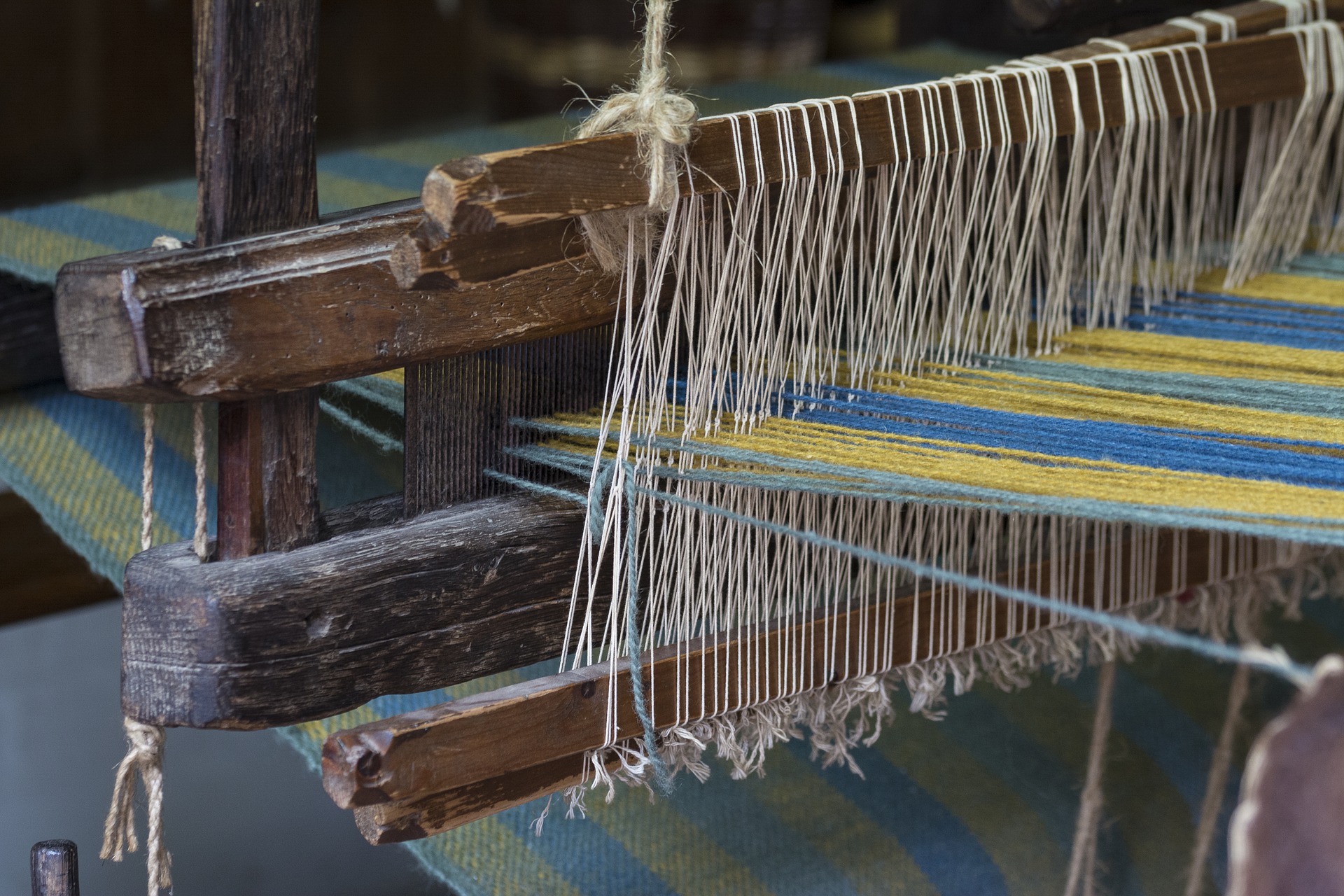 Strings crisscrossing in a textile loom